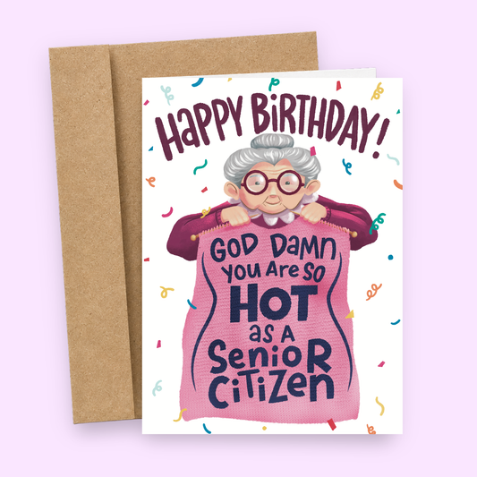 Sleazy Greetings funny birthday card featuring a sweet little grandma knitting a blanket that says ‘God Damn You Are So Hot as a Senior Citizen.’ Hilarious aging humor greeting card with cozy grandma artwork, colorful confetti accents, and sarcastic birthday compliment energy.