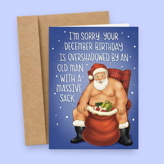 Sleazy Greetings funny December birthday card featuring the phrase ‘I’m Sorry Your December Birthday Is Overshadowed By An Old Man With A Massive Sack’ with a humorous illustration of Santa Claus sitting beside a large bag of presents. Adult humor holiday birthday greeting card with snowy accents and a kraft envelope included.