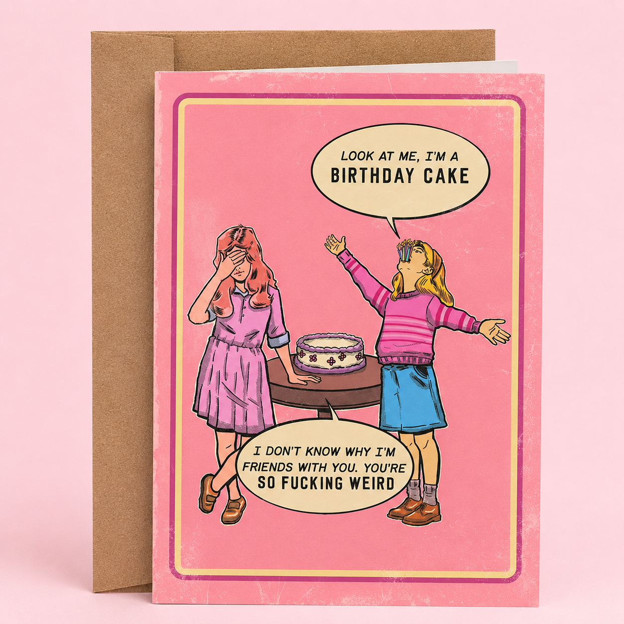 Sleazy Greetings funny birthday card featuring a retro-style illustration of two girls at a birthday party with absurd humor dialogue about pretending to be a birthday cake. The vintage-inspired pink card design includes the phrases ‘Look at me, I’m a birthday cake’ and ‘I don’t know why I’m friends with you. You’re so fucking weird.’ Displayed as a premium folded Sleazy Greetings card with kraft envelope.