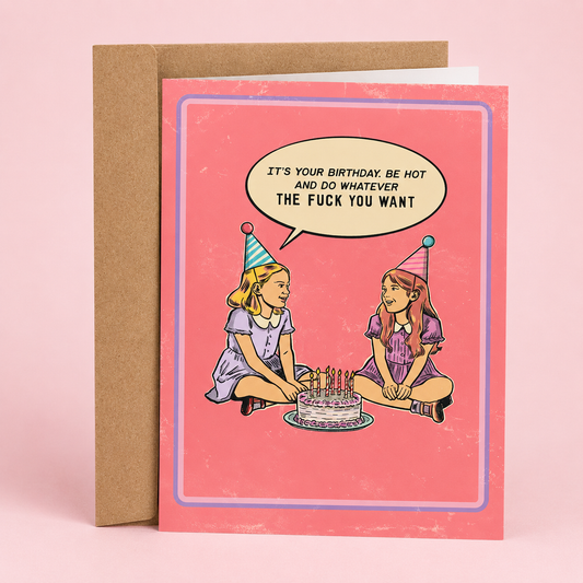 Sleazy Greetings funny birthday card featuring a retro-style illustration of two girls wearing party hats sitting beside a birthday cake with bold humorous dialogue. The vintage-inspired pink card design includes the phrase ‘It’s your birthday. Be hot and do whatever the fuck you want.’ Displayed as a premium folded Sleazy Greetings card with kraft envelope.