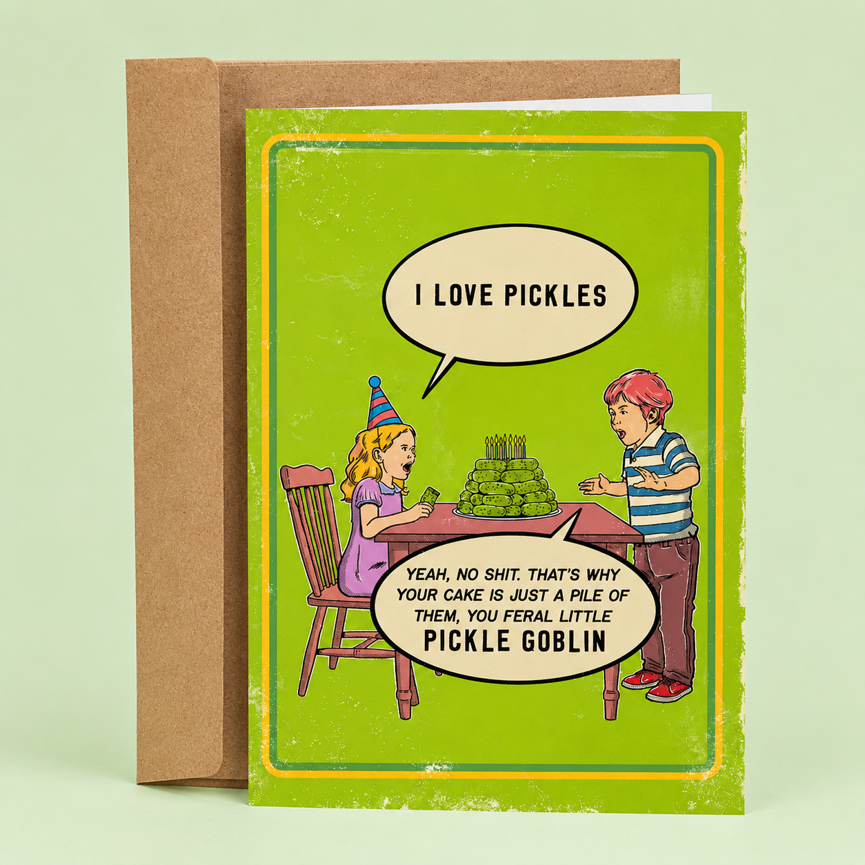 Funny vintage-style pickle birthday card by Sleazy Greetings. Kid gets a cake made of pickles—because they “love pickles.” Snarky, absurd humor. Includes kraft envelope.