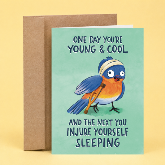 Sleazy Greetings funny birthday card featuring a goofy bluebird with a head bandage and crutches alongside the phrase, “One Day You're Young & Cool and the Next You Injure Yourself Sleeping.” Humorous birthday greeting card perfect for friends, family, coworkers, and anyone getting older with a sense of humor.