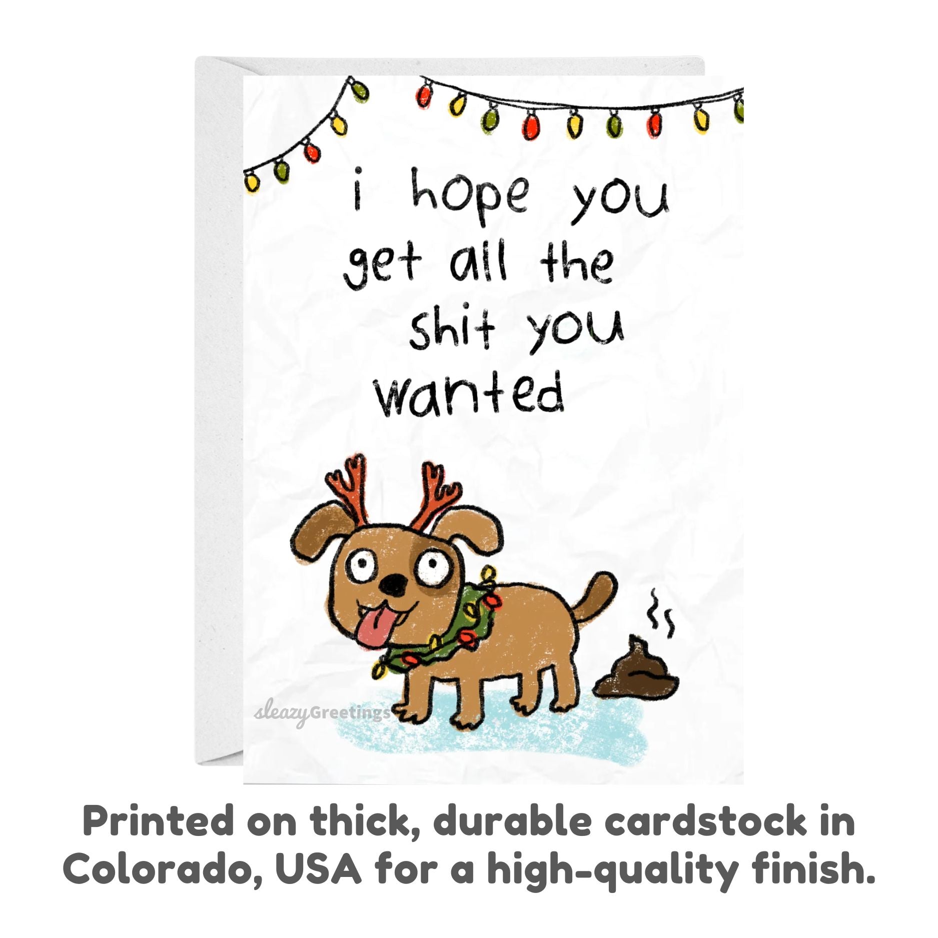 Card with a cartoon dog wearing reindeer antlers and a Christmas wreath, with text above it.
